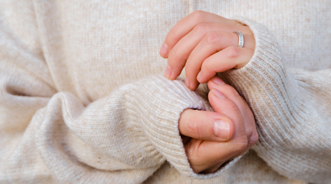 A person holding their hands together.